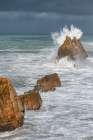 Spain, Liencres. Ocean waves and sea stack formations. Art Print